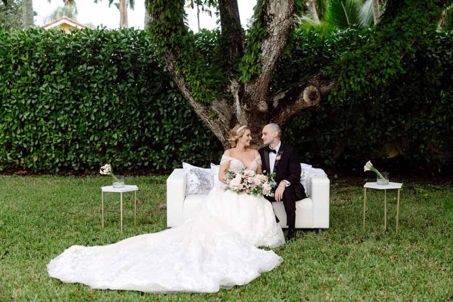 married couple sitting on a sofa