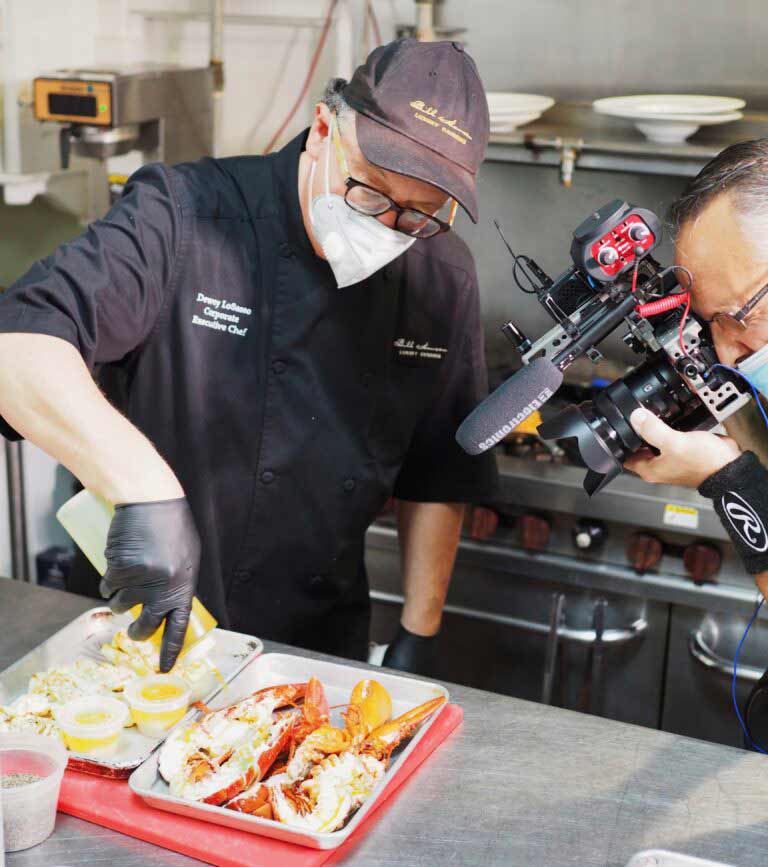 camera man is recording a man cooking