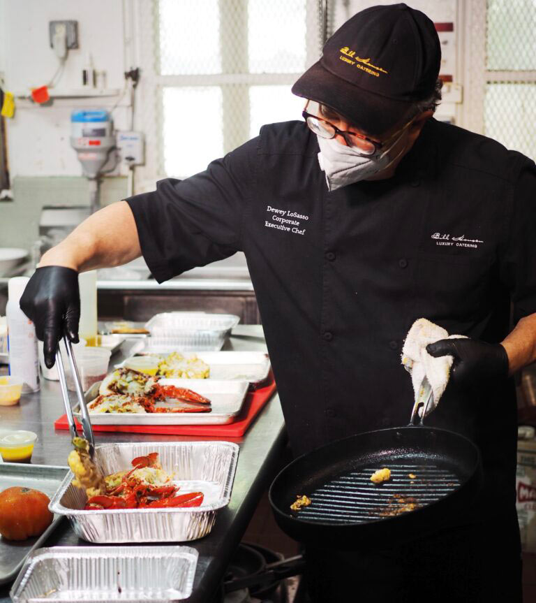 chef displaying food on tray