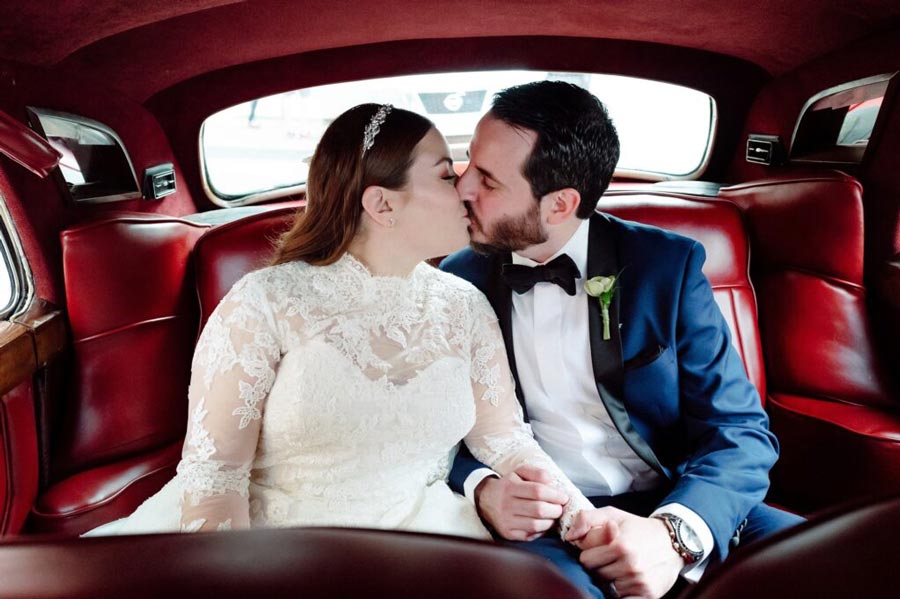 couple kissing in a car