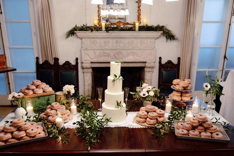 a table full of donuts and cakes