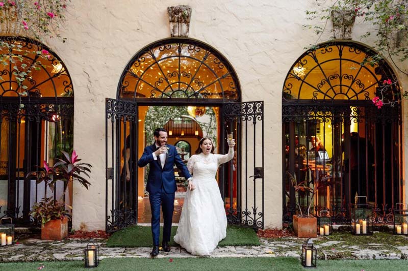 couple in a wedding coming from an entrance