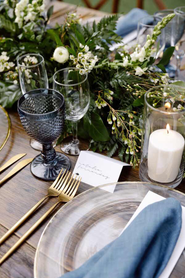 dining table decorated with flowers and wine glass