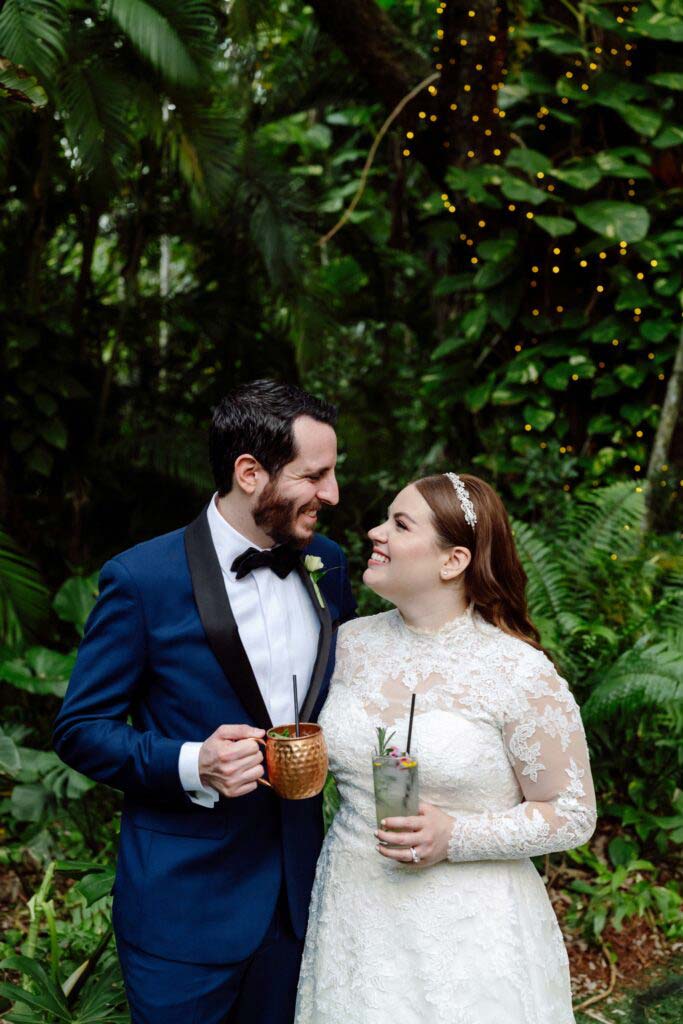 couple looking at each other with drinks in their hand