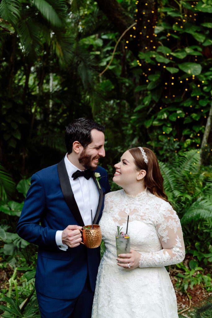 couple looking at each other with drinks in their hand