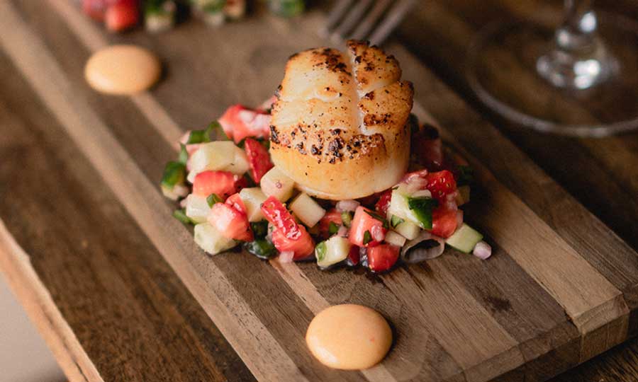 burger on a wooden plate