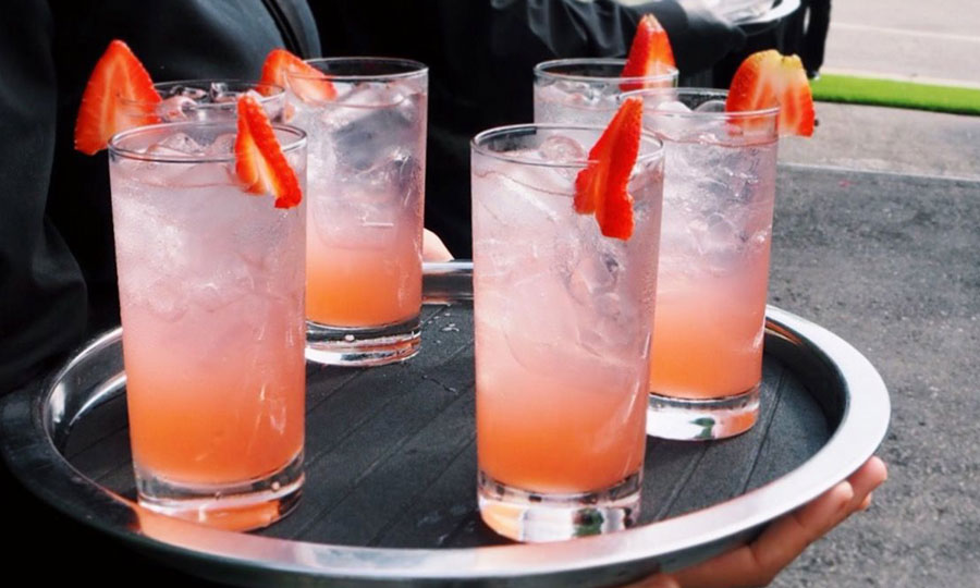 four glass of juice on a tray