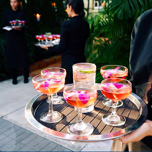 server carrying tray of drinks